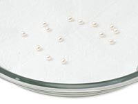 Pearls lain out separately in a dish